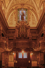 Fototapeta na wymiar The organ of S. Antonio dei Portoghesi church in the Campo Marzio district of Rome