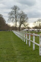 Fototapeta na wymiar white fence in the park