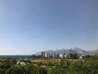 Skyline of Providencia district in Santiago de Chile with snowed Andes mountain range in the background. This is a wealthy residential and commercial district in the city