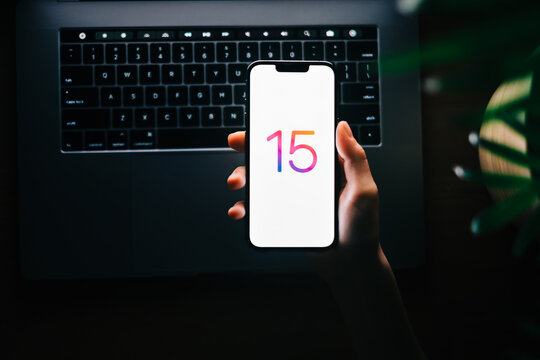 iPhone 13 pro with iOS 15 logo on the screen close up, new operating system 2021 on apple devices. Rostov-on-Don, Russia. 20 November 2021 