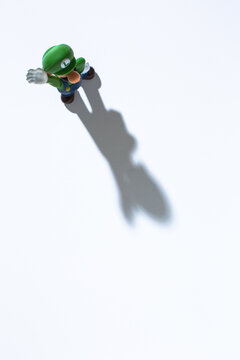 Moscow, Russia - November 27, 2021: Top view of plastic figure of Luigi from Nintendo video game.