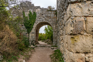 Fototapeta na wymiar Old ruined fortress gate, Mangup-Kale city in the Crimea.
