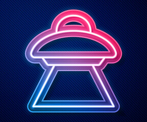 Glowing neon line UFO flying spaceship icon isolated on blue background. Flying saucer. Alien space ship. Futuristic unknown flying object. Vector