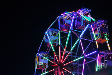 Beautiful of ferris wheel at temple fair night