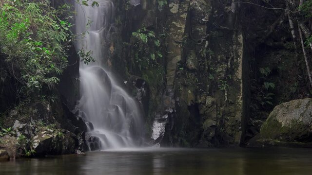 Time lapse of a man enjoyng a waterfall close to Tiradentes city, Minas Gerais state, Brazil