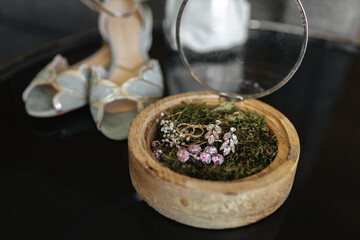Beautiful wedding rings displayed on top of flowers