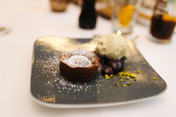 Delicious Chocolate Souffle on a nicely decorated plate at a restaurant