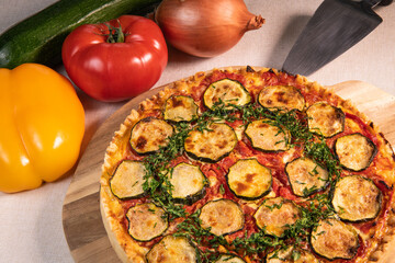 Vegetarian Provencal quiche recipe with vegetables, zucchini, tomato, pepper, onion, parsley. High quality photo