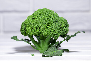 Raw green broccoli on white background, healhy eating diet