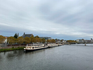 Fototapeta na wymiar The Maas river on a cloudy autumn day