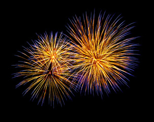 Gold and blue fireworks, isolated on a black background