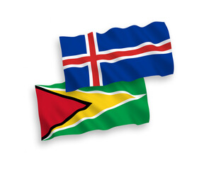 National vector fabric wave flags of Co-operative Republic of Guyana and Iceland isolated on white background. 1 to 2 proportion.