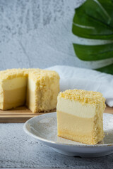 Double Fromage cheesecake on wood board