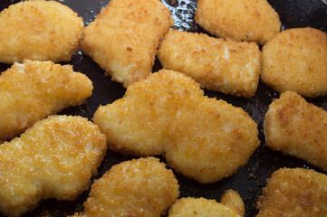 Chicken nuggets in the frying pan