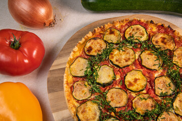 Vegetarian Provencal quiche recipe with vegetables, zucchini, tomato, pepper, onion, parsley. High quality photo