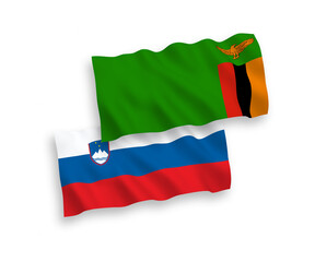 National vector fabric wave flags of Slovenia and Republic of Zambia isolated on white background. 1 to 2 proportion.
