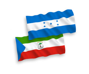 National vector fabric wave flags of Republic of Equatorial Guinea and Honduras isolated on white background. 1 to 2 proportion.