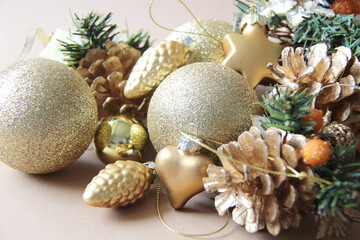 Christmas decorations, golden baubles and pine cones
