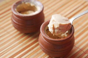 fresh yogurt in a bowl on table 