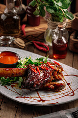 Portion of gourmet cooked lamb shank with red sauce