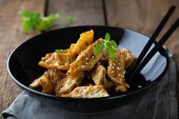 Gyoza with duck and sesame seeds