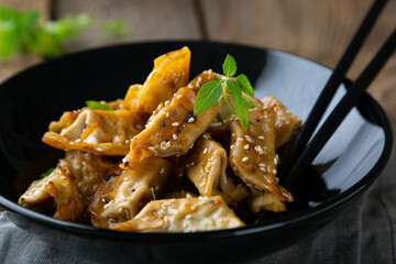 Gyoza with duck and sesame seeds