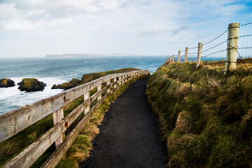 A stunning trekking path in Giant's Causeway, Northern Ireland. An ideal destination for hiking and...