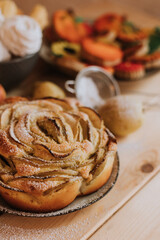 apple pie charlotte closeup. homemade cakes, sweets and fruits are on the wooden kitchen table. High quality photo