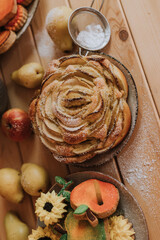 homemade cakes, sweets and fruits are on the wooden kitchen table. waffles, marshmallows, marmalade, cookies, gingerbread, apple pie. High quality photo
