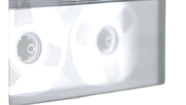 turned on tape recorder, rotating cassette close-up