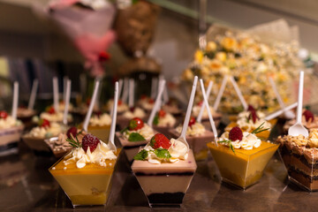 Small berry desserts in a plastic cup. With a spoon