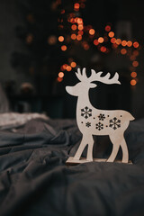 christmas decoration wooden deer on dark background