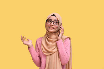 muslim girl wearing hijab having pleasant phone communication indian pakistani model