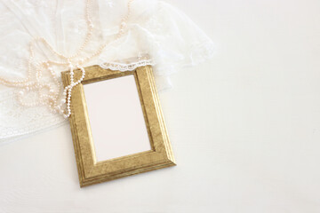 Background of white delicate lace fabric and pearls