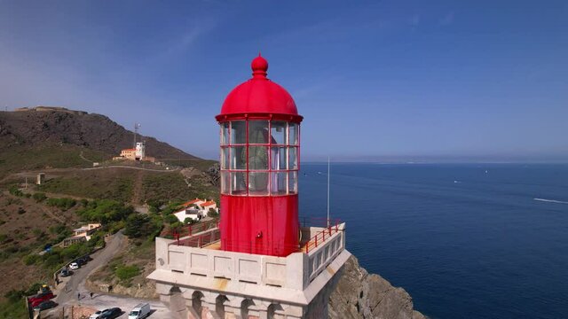 Aerial shot from top of the lighthouse to the sea with overview of the rocky coastline, Cap Bear, France