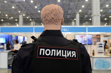 Patch on the back of the uniform "Police"