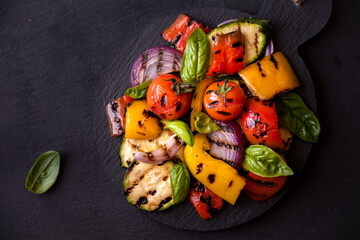 Grilled mixed vegetables, cooked peppers, zucchini, tomatoes and onions. Healthy vegetarian food