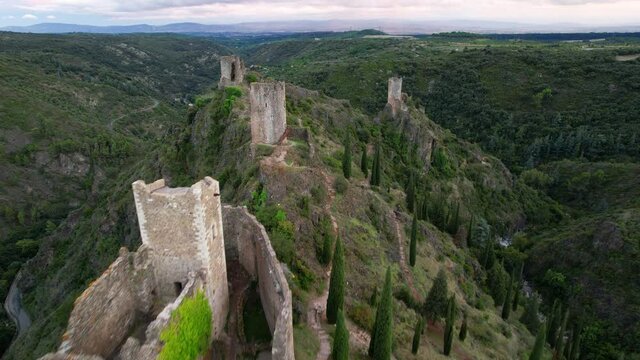 Aerial shot of the 4 towers ruins of the Lastours medieval castle built by the Cathars  in the Aude department, France