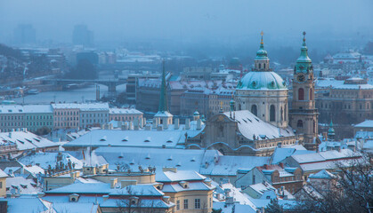 Prague in winter - snowy Lesser Town roofs