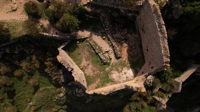 Aerial shot from ground to above overview of the Cathar medieval castle of Peyrpeteruse in south of France
