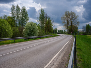 Fototapeta na wymiar simple asphalt road in perspective