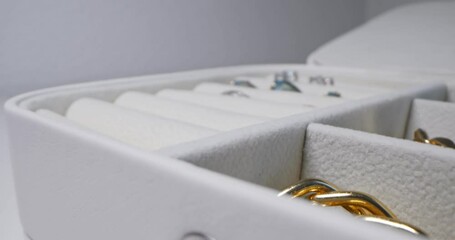 detailed extreme close-up. jewelry in a modern leather box