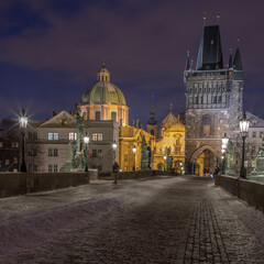 Fototapeta na wymiar Prague - evening on the snowy Charles Bridge