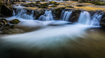 Fototapeta premium The Dobra River is a short mountain river in northern Spain that originates in the province of Leon and runs almost entirely through the central-eastern area of the Principality of Asturias.