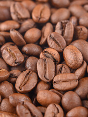 Coffee beans pattern macro. Photo vertical espresso aroma caffeine