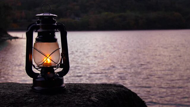 Light an oil lantern by the twilight lake.