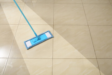 Washing of floor with mop. Difference before and after cleaning