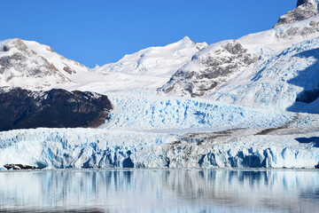 Spegazzini glacier in a beautiful sunny day, showing vibrant blue ice in contrast with white snow, Argentina