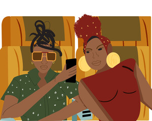 Lesbian couple on a airplane taking a selfie