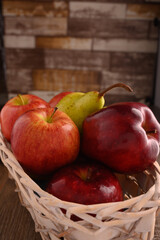 Apple fruit and pear fruit macro in basket.